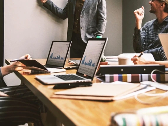 Group of business professionals working around a table